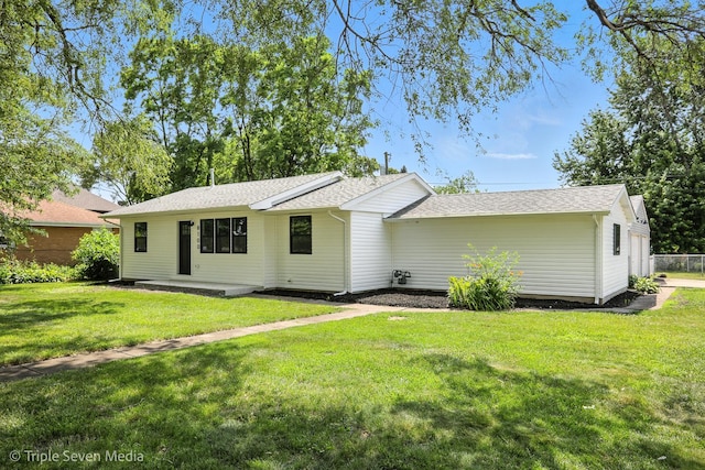 8100 Lockwood Ave, Burbank, IL 60459 - rear view of property featuring a lawn and roof with shingles