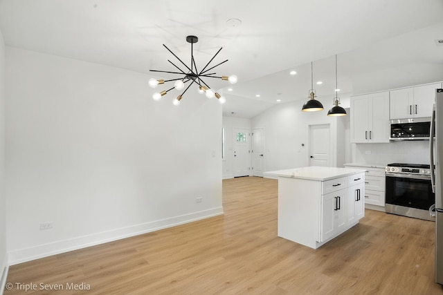 8100 Lockwood Ave, Burbank, IL 60459 - kitchen with stainless steel appliances, a chandelier, light wood-style flooring, white cabinets, and a center island