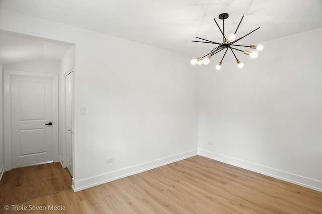 8100 Lockwood Ave, Burbank, IL 60459 - spare room with a chandelier and light wood finished floors