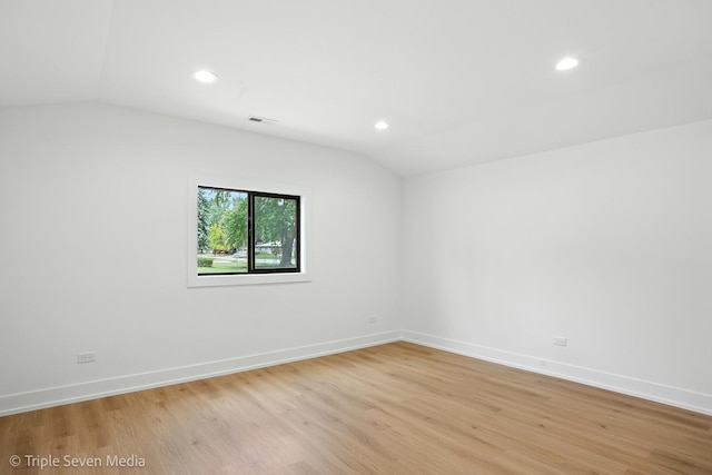 8100 Lockwood Ave, Burbank, IL 60459 - spare room with lofted ceiling, light wood-type flooring, and recessed lighting