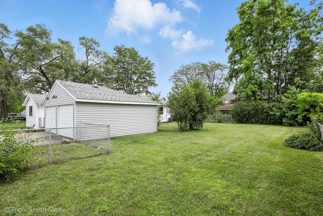 8100 Lockwood Ave, Burbank, IL 60459 - view of yard featuring a garage