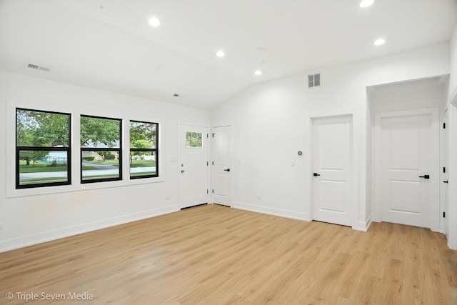 8100 Lockwood Ave, Burbank, IL 60459 - spare room with light wood finished floors, recessed lighting, and lofted ceiling