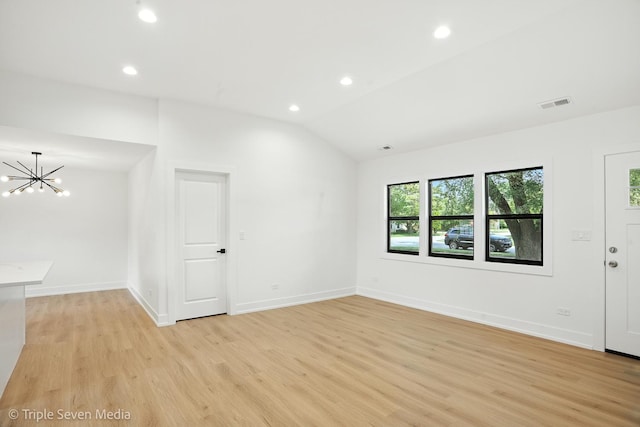 8100 Lockwood Ave, Burbank, IL 60459 - unfurnished room featuring a chandelier, light wood-style floors, lofted ceiling, and recessed lighting
