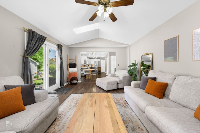 417 Chadsford Ct, Carol Stream, IL 60188 - living room featuring vaulted ceiling, wood finished floors, a skylight, a ceiling fan, and a chandelier