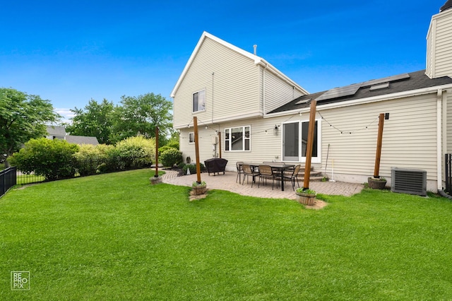 417 Chadsford Ct, Carol Stream, IL 60188 - back of property with roof mounted solar panels, a patio area, and a fenced backyard