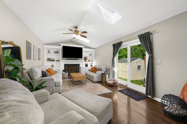 417 Chadsford Ct, Carol Stream, IL 60188 - living area with a skylight, a ceiling fan, lofted ceiling, dark wood-type flooring, and a fireplace