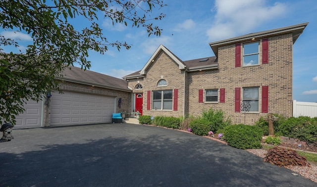 2069 Willow Brook Dr, Bourbonnais, IL 60914 - view of front of home featuring brick siding, a garage, and asphalt driveway