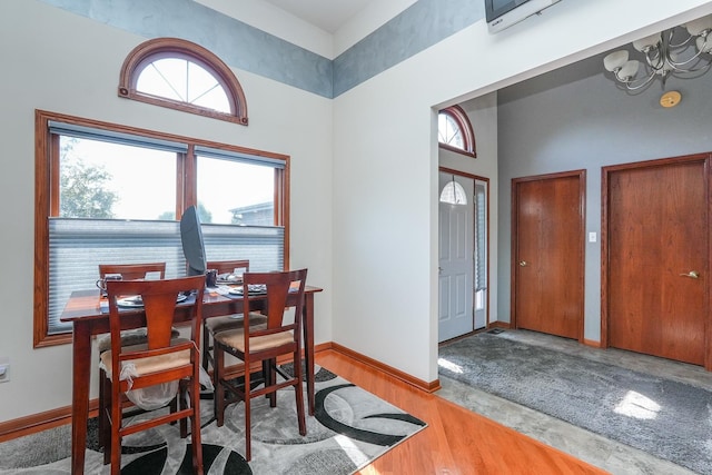 2069 Willow Brook Dr, Bourbonnais, IL 60914 - dining area featuring a chandelier and a towering ceiling