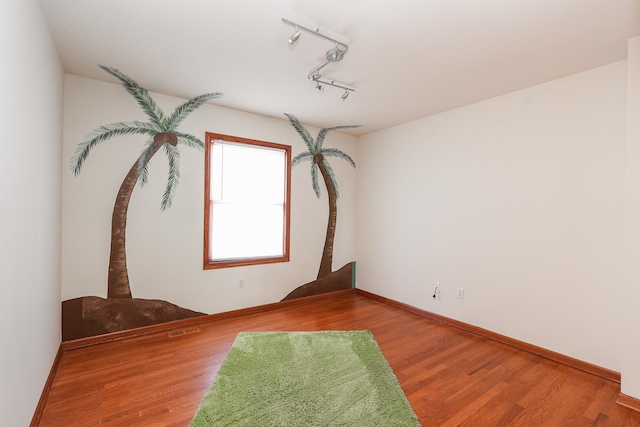 2069 Willow Brook Dr, Bourbonnais, IL 60914 - empty room with rail lighting and wood finished floors