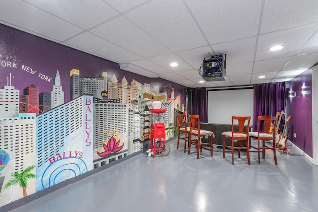 2069 Willow Brook Dr, Bourbonnais, IL 60914 - cinema room featuring concrete floors, a paneled ceiling, and recessed lighting