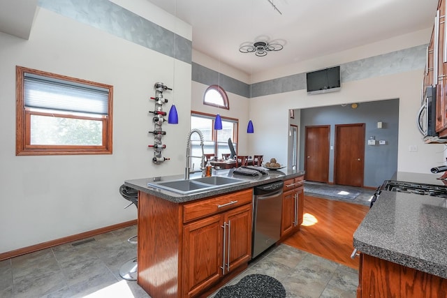 2069 Willow Brook Dr, Bourbonnais, IL 60914 - kitchen featuring stainless steel appliances, dark countertops, and brown cabinetry