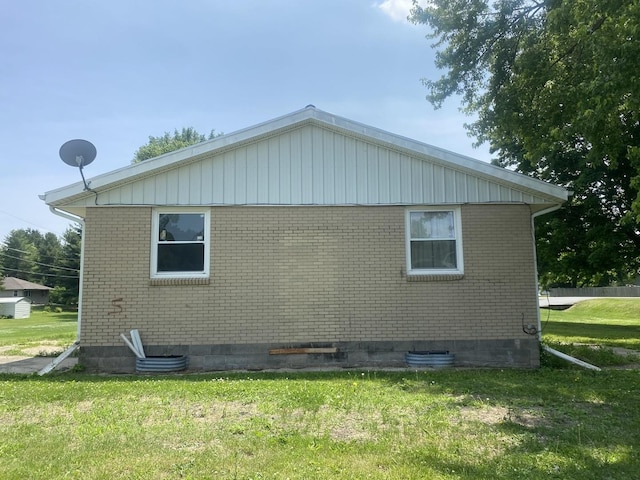 217-219 Mulvain St, Durand, IL 61024 - view of property exterior featuring a lawn and brick siding