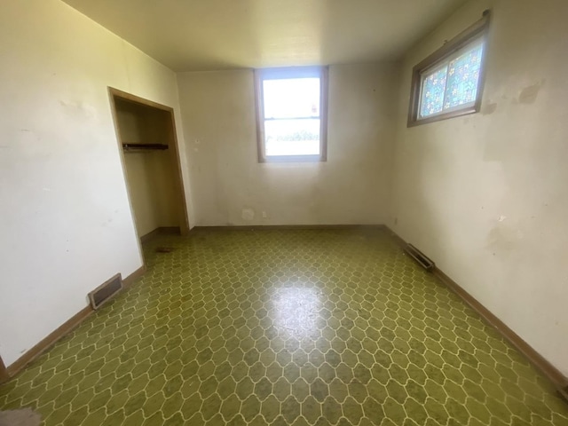 217-219 Mulvain St, Durand, IL 61024 - unfurnished bedroom featuring dark floors and a closet