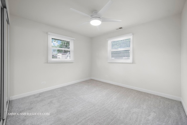 1607 Warwick Ln, Schaumburg, IL 60193 - carpeted spare room featuring a ceiling fan and baseboards
