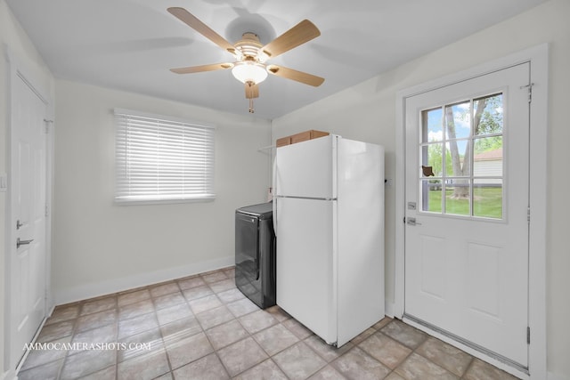 1607 Warwick Ln, Schaumburg, IL 60193 - kitchen featuring freestanding refrigerator, washer / dryer, and a ceiling fan
