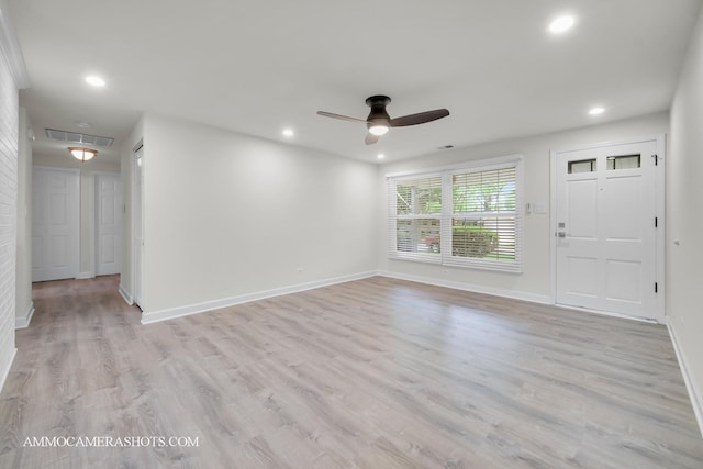 1607 Warwick Ln, Schaumburg, IL 60193 - unfurnished living room featuring a ceiling fan, light wood finished floors, and recessed lighting