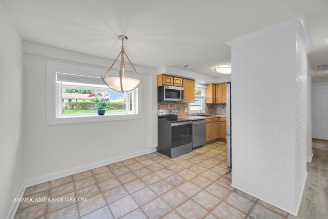 1607 Warwick Ln, Schaumburg, IL 60193 - kitchen with appliances with stainless steel finishes, backsplash, and hanging light fixtures