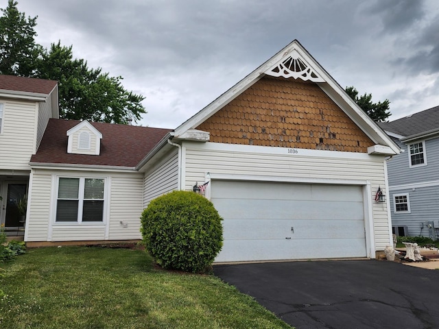 1036 Georgian Pl, Bartlett, IL 60103 - view of front of property with asphalt driveway, a front yard, and an attached garage