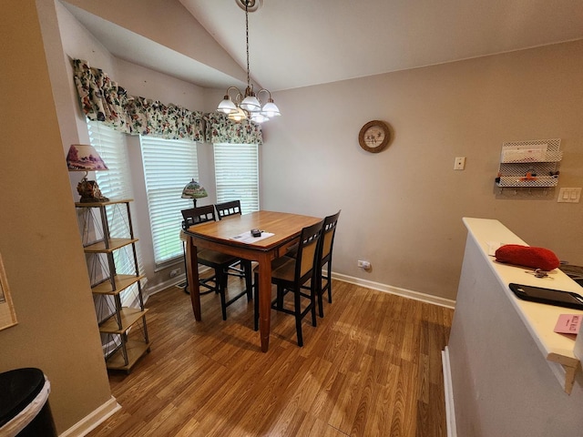 1036 Georgian Pl, Bartlett, IL 60103 - dining room featuring vaulted ceiling, wood finished floors, and a chandelier