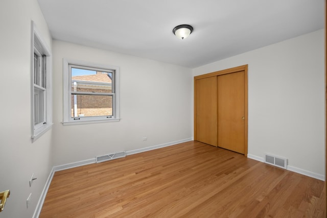 4316 N Sayre Ave, Norridge, IL 60706 - unfurnished bedroom with light wood-style flooring and a closet
