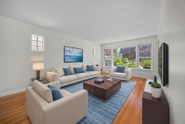 4316 N Sayre Ave, Norridge, IL 60706 - living room featuring light wood-style floors and baseboards