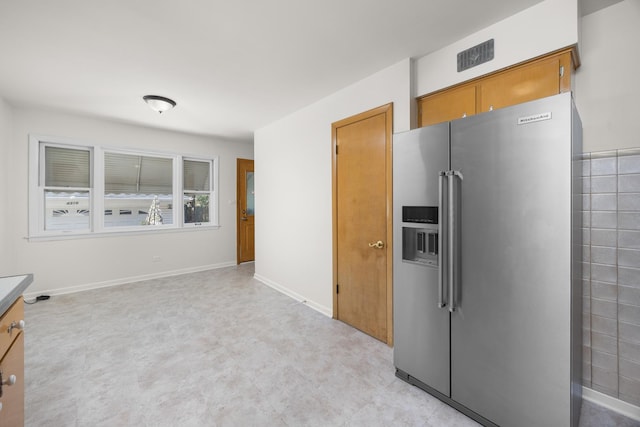 4316 N Sayre Ave, Norridge, IL 60706 - kitchen with high end refrigerator, light flooring, and brown cabinetry