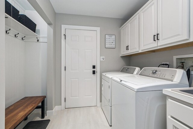 16243 Hummingbird Hill Dr, Orland Park, IL 60467 - laundry room with cabinet space and washing machine and dryer