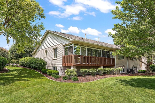 16243 Hummingbird Hill Dr, Orland Park, IL 60467 - rear view of house with a sunroom, a yard, and a shingled roof