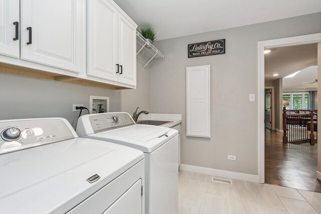 16243 Hummingbird Hill Dr, Orland Park, IL 60467 - washroom with washing machine and dryer and cabinet space