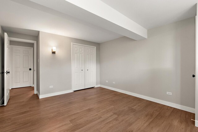 16243 Hummingbird Hill Dr, Orland Park, IL 60467 - unfurnished bedroom featuring wood finished floors and a closet