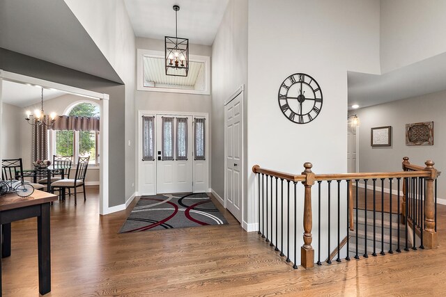 16243 Hummingbird Hill Dr, Orland Park, IL 60467 - foyer entrance with a chandelier, a high ceiling, and wood finished floors