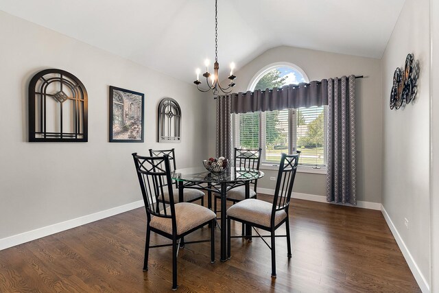 16243 Hummingbird Hill Dr, Orland Park, IL 60467 - dining room featuring a chandelier, vaulted ceiling, and dark wood-style flooring
