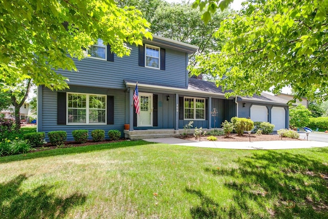 400 Seafarer Dr, Third Lake, IL 60030 - view of front of home with a porch, a garage, a front lawn, and board and batten siding