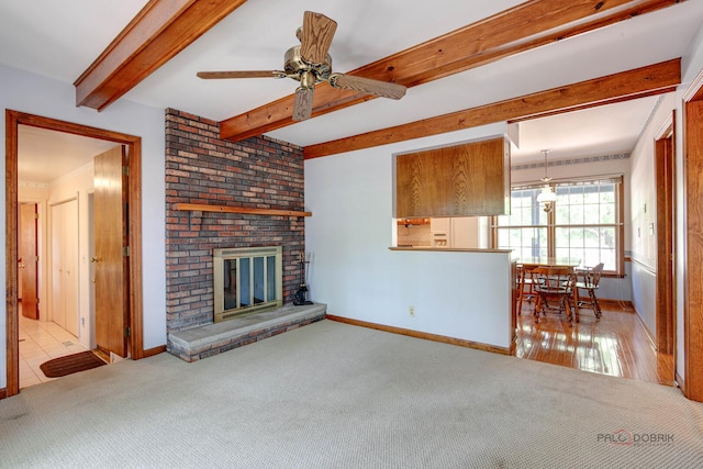 400 Seafarer Dr, Third Lake, IL 60030 - living room with beam ceiling, carpet flooring, a ceiling fan, and a brick fireplace