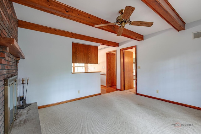 400 Seafarer Dr, Third Lake, IL 60030 - unfurnished living room with beam ceiling, a brick fireplace, carpet, and ceiling fan