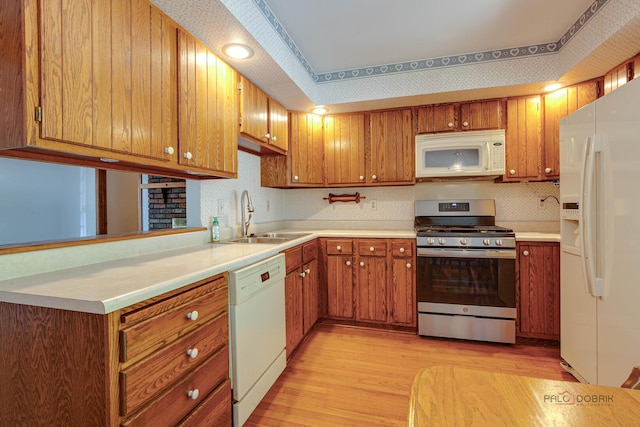 400 Seafarer Dr, Third Lake, IL 60030 - kitchen with white appliances, light wood-type flooring, brown cabinetry, and light countertops