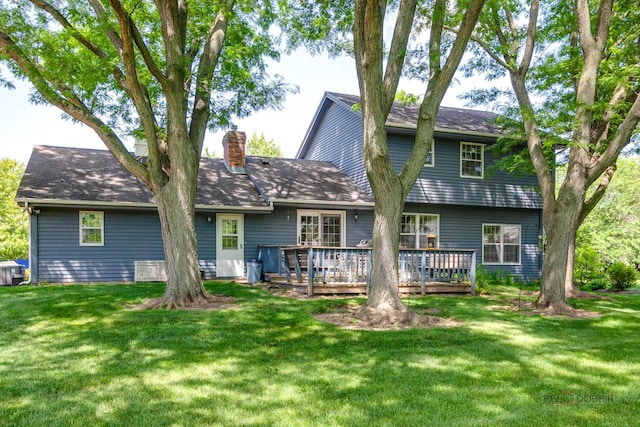400 Seafarer Dr, Third Lake, IL 60030 - rear view of house featuring a chimney, a deck, and a lawn