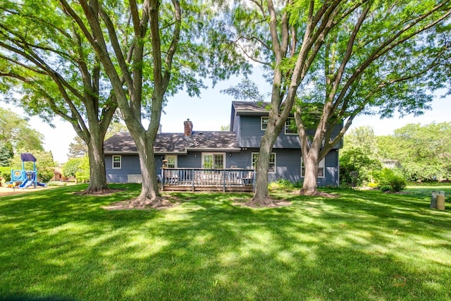 400 Seafarer Dr, Third Lake, IL 60030 - rear view of property featuring a wooden deck, a yard, and a chimney