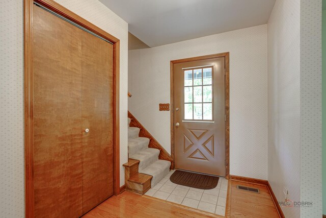 400 Seafarer Dr, Third Lake, IL 60030 - entryway featuring light wood-style floors and stairway