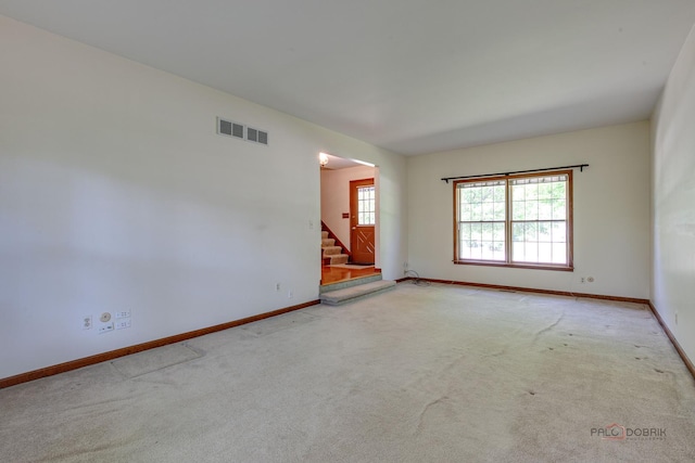 400 Seafarer Dr, Third Lake, IL 60030 - carpeted spare room featuring stairway and baseboards