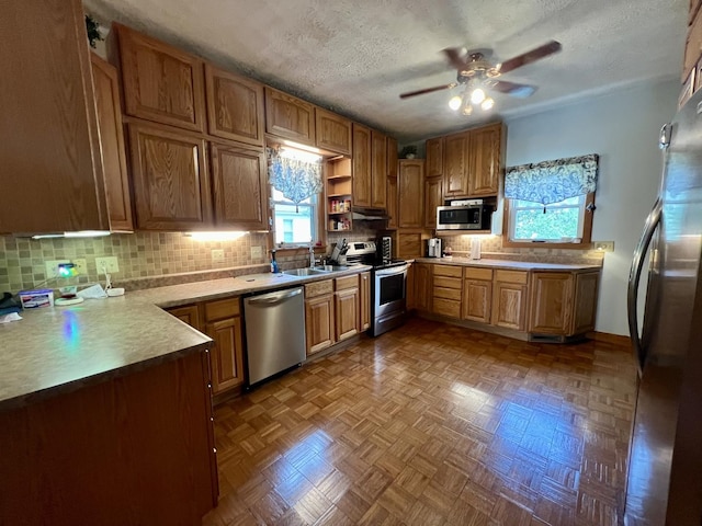 205 E St, Penfield, IL 61862 - kitchen featuring appliances with stainless steel finishes, tasteful backsplash, a ceiling fan, a textured ceiling, and open shelves