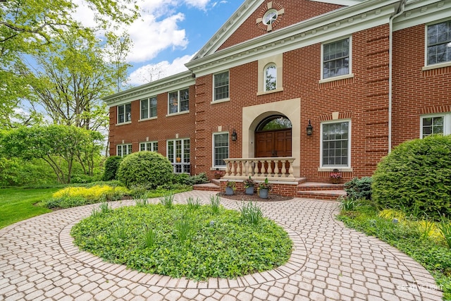 1900 Millburne Rd, Lake Forest, IL 60045 - colonial-style house with brick siding and a porch