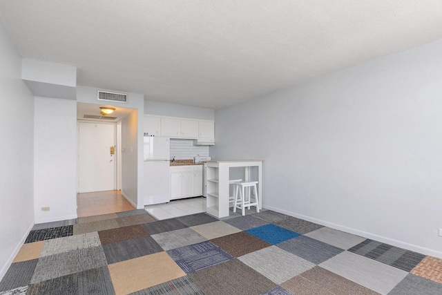 7234 W N Ave Unit 1203, Elmwood Park, IL 60707 - spare room with baseboards and a sink