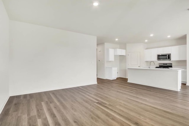14653 S Greenbriar Dr, Plainfield, IL 60544 - unfurnished living room featuring light wood-type flooring and recessed lighting