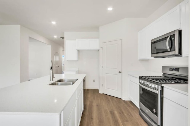 14653 S Greenbriar Dr, Plainfield, IL 60544 - kitchen featuring stainless steel appliances, wood finished floors, light countertops, recessed lighting, and white cabinetry