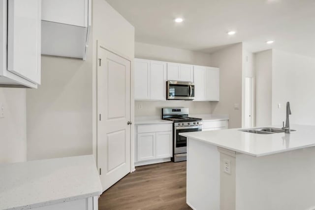 14653 S Greenbriar Dr, Plainfield, IL 60544 - kitchen with appliances with stainless steel finishes, light countertops, white cabinetry, recessed lighting, and wood finished floors