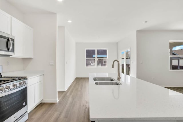 14653 S Greenbriar Dr, Plainfield, IL 60544 - kitchen with appliances with stainless steel finishes, white cabinets, light wood-type flooring, and recessed lighting