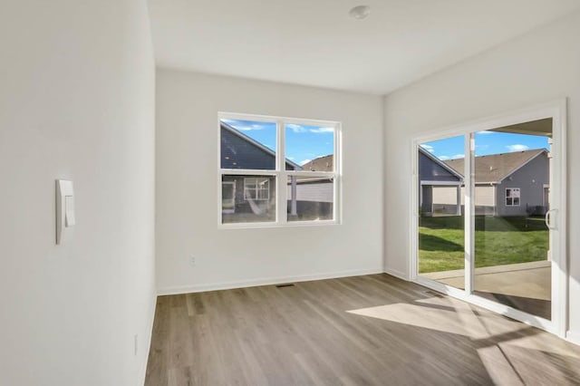 14653 S Greenbriar Dr, Plainfield, IL 60544 - unfurnished room with wood finished floors and plenty of natural light