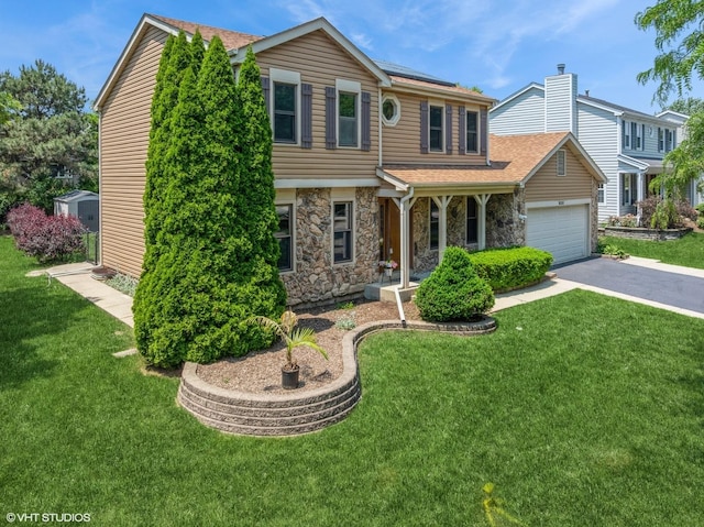 600 N Brookdale Dr, Schaumburg, IL 60194 - view of front of property featuring stone siding, driveway, an attached garage, a front lawn, and a shingled roof