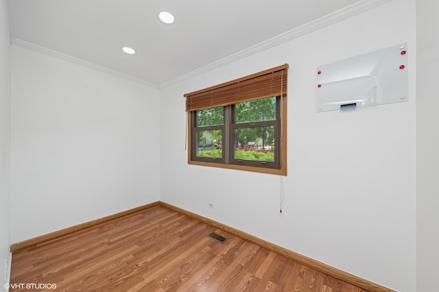 600 N Brookdale Dr, Schaumburg, IL 60194 - spare room featuring crown molding, light wood-type flooring, and recessed lighting